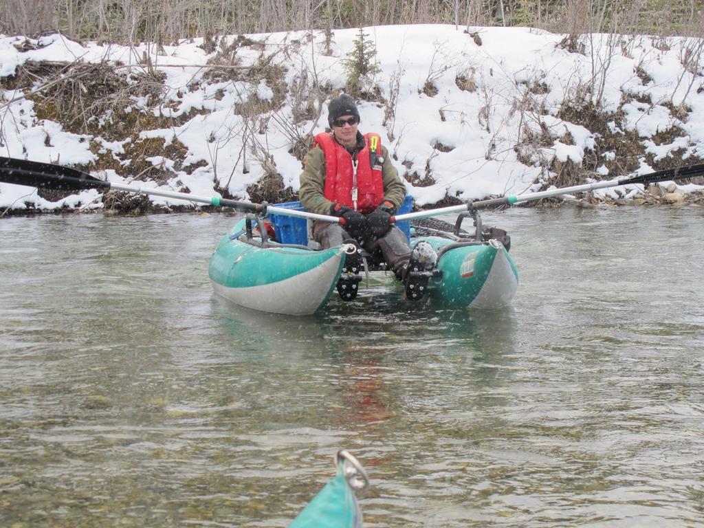 Alberta Conservation Association biologist Kevin Fitzsimmons floating the Clearwater