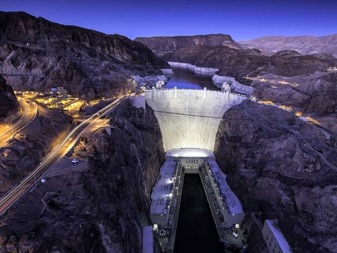 Glossary Lights come on in the evening, making Hoover Dam even more beautiful. Today changed many people s lives. The river s water helps crops grow in dry areas of the United States.