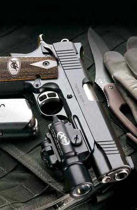 1911 PISTOLS Tactical II Checkering on the front strap and under the trigger guard, night sights, extended ambidextrous thumb safety and beveled magazine well are among the no-nonsense features on