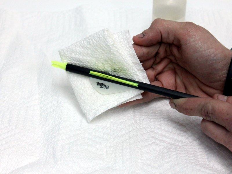 Be sure the paper towel is sufficiently soaked with acetone.