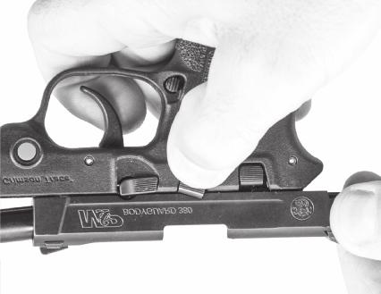 Place the safety lever (if your pistol is so-equipped) into the down fire position to allow the slide to be moved rearward. Make certain that the chamber is clear.