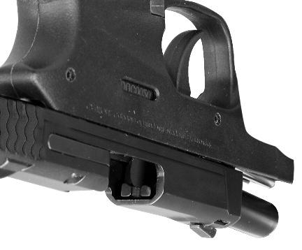 rear with the thumb and fingers (FIGURE 21) while holding the firearm in an upright position, and briskly draw the slide fully rearward in order to extract any cartridge
