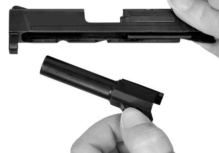 Remove the recoil spring from the slide (FIG. 31). Remove the barrel from the slide (FIGURE 32).