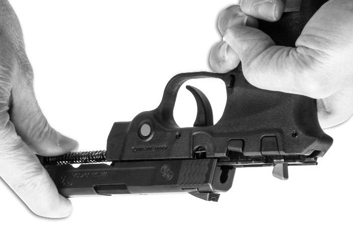 FIGURE 42 While retaining the recoil spring assembly in position, push the slide assembly onto