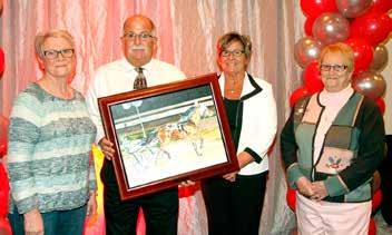 This year s recipient was Dennis Osterholt ( Big D ) for his outstanding lifetime service and dedication to the harness racing industry and the humanitarian outreach he has extended voluntarily to