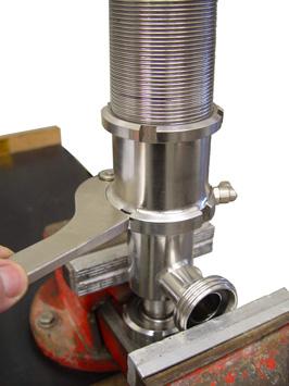 Clamp the valve insert at the threads (G1) in a vise with soft jaws. Measure and log the pressure setting dimensions (Y) (see Fig. 2 / page 7). Unscrew nut (15).