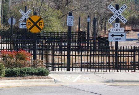 Pedestrian Safety at Rail Crossings DESCRIPTION Passive devices: fencing, channelization, swing gates, pedestrian barriers, pavement markings and texturing, etc.