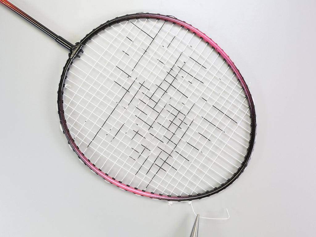 Step 11 At the end of the strand (right when the racquet naturally begins to curve), pull the strings tight.