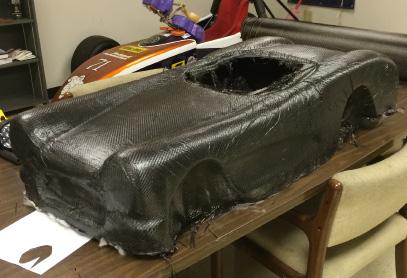 even finish and resin distribution Below: The finished carbon fiber body, ready for trimming, painting and final