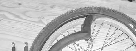 Mount one side of the tire on the rim, and then push the inner tube into the partially mounted tire. Make sure the tube is not folded or twisted.