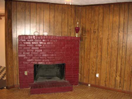 Living room has paneling throughout