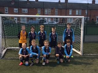 the trophy (which I thought they deserved for playing the best football) but they can be extremely proud of their achievement in coming second out of 16 schools. Smile!