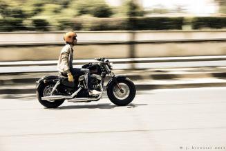 motorcycle down a street motorcycle down a street GT: The motorcyclist has his