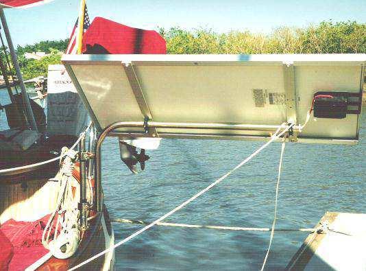 docking or in large seas. We use PVC tubes to hold the panels horizontal, coupled with a piece of line brought down through the hawse holes and cleated off to keep them from flying up in a gust.