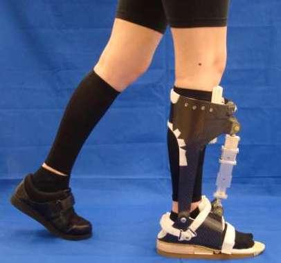A custom AFO-footwear combination was fit to each subject s right lower limb to constrain ankle motion as each