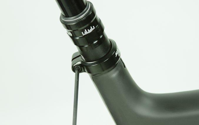 11 Position the seatpost at the desired ride height and tighten the
