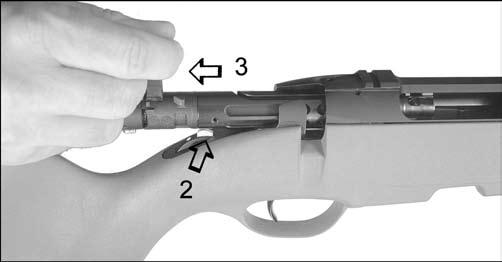 With your right hand, turn bolt handle 70 to the left (unlocking). 2.