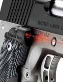 aiming regardless of light conditions. Lasers are an invaluable training tool, quickly illustrating proper grip and trigger control. Custom features include a recessed slide stop pin.