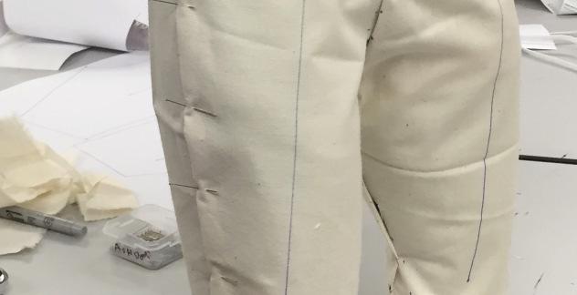 A series of pattern adjustments and iterations of prototype pants were realized, until a satisfactory fit was obtained for both the standing and active posed half scale dress forms.