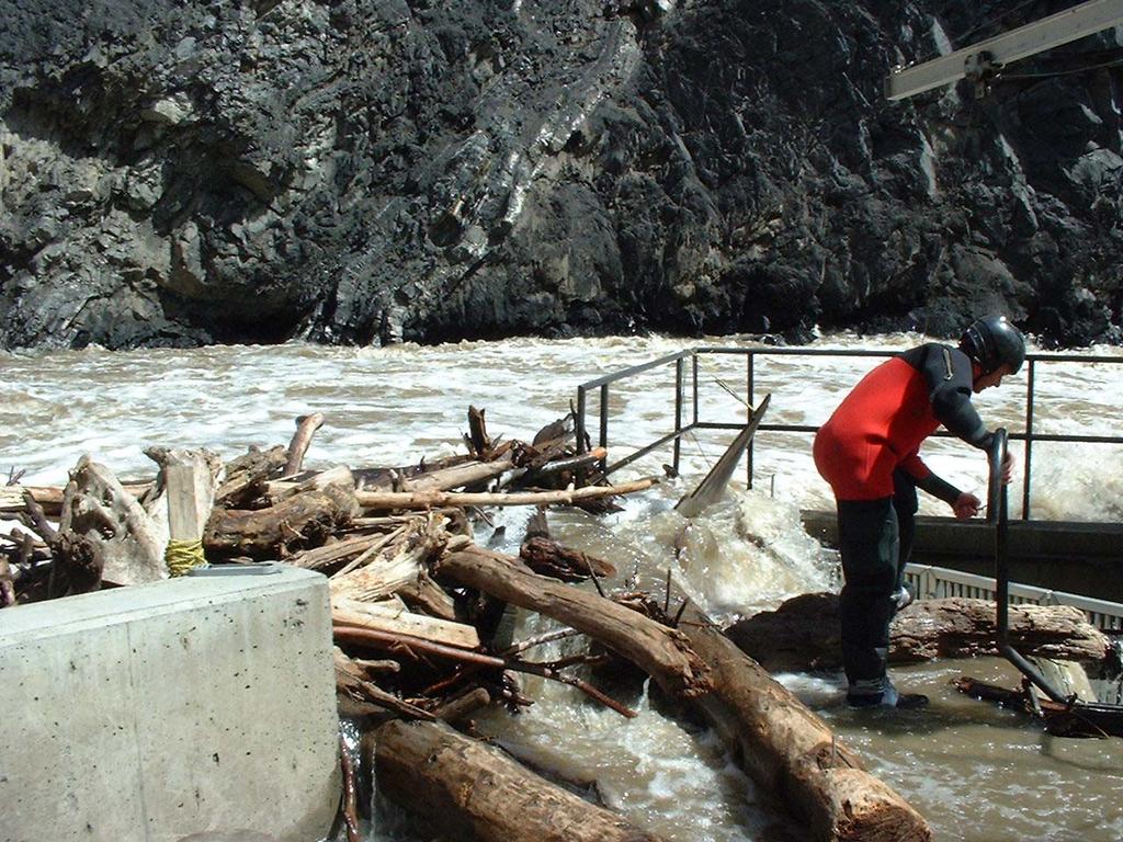 Figure 4. High water flows and debris accumulation at the Bonaparte Fishway, May 27, 2002. 3.