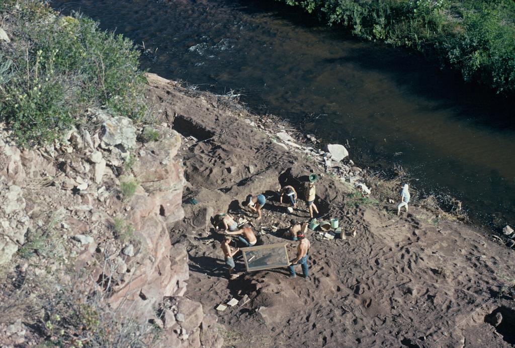View from the top of the cliff of the 1970 excavation and the North Fork of the Cache La Poudre River.