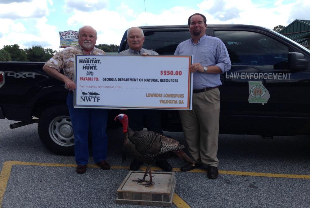ECHOLS COUNTY On August 21 st, Sergeant Patrick Dupree met with members of Lowndes Longspurs chapter of the National Wild Turkey Federation to receive a check to cover costs for a turkey decoy to be