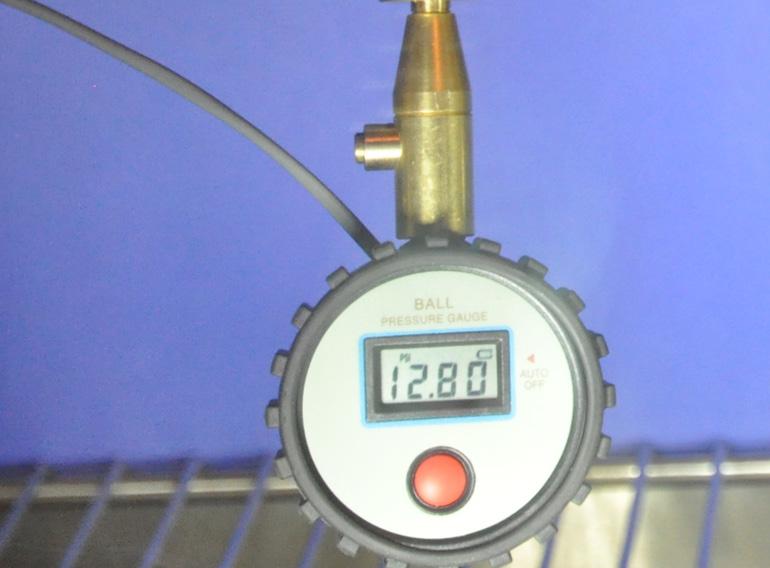 Figure 10. Close-up image of the Exemplar Gauge showing battery indicator (indicated by the arrow) on the LCD screen. The battery indicator is illuminated when the applied voltage is approximately 2.