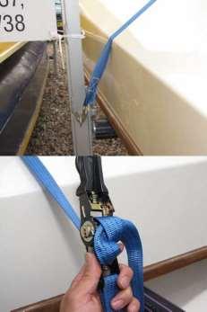 Strap twisted against the boat, immediately after hook. Also boat not flush against vertical support beam.