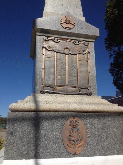 (Crown and cross), is displayed above the honour roll, and the Queensland Railways insignia