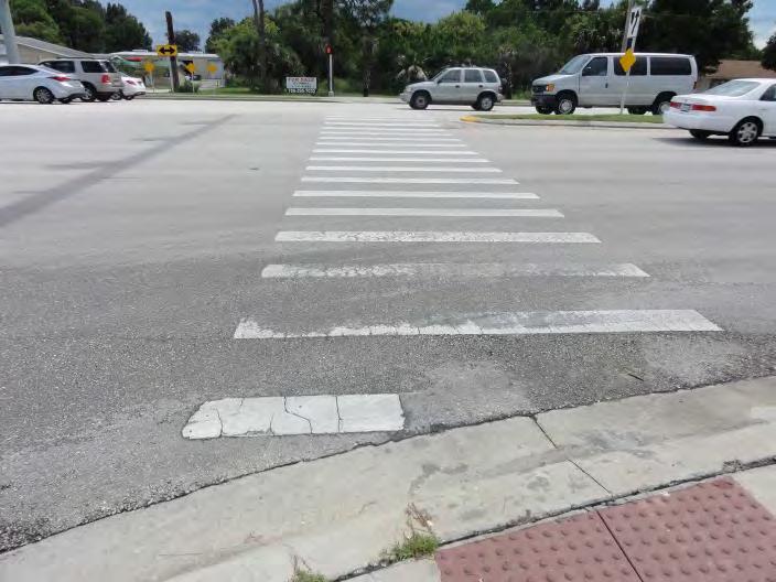 Crosswalk markings at some signalized intersections are beginning to wear (illustrated in Figure 3).