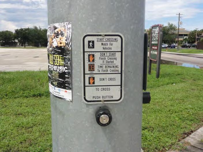 Issue #0: Pedestrian Push Button Signage Location: Pinewood Drive Intersection Figure 36 Figure 37 Description of Issue: The pedestrian push button signage on northwest