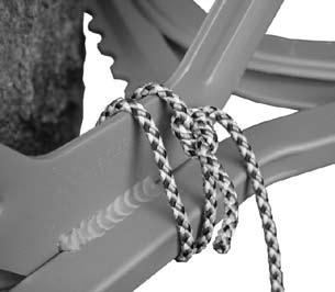 WARNING: The standing platform and climber MUST BE attached to each other with the tether rope supplied, as shown in Figure 16. Wrap the rope around TWICE before tying it off.
