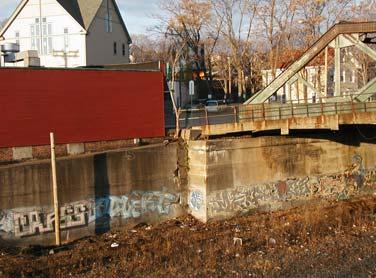 4.9 Cross Street Existing Conditions: Cross Street passes over the New Hampshire Main Line via a steel truss structure that was constructed in 1928.