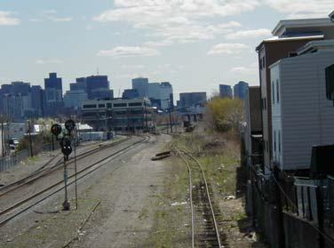Washington Street is approximately 820 linear feet. The vertical elevation of Cross Street is approximately El. 42.0. The vertical elevation of the tracks above Washington Street is approximately El.