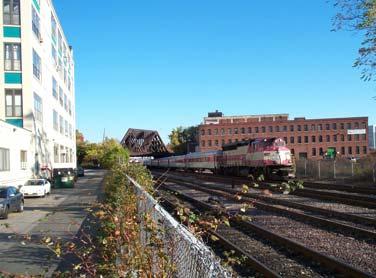 2,500 linear feet. The vertical elevation of the tracks between Washington Street and the Fitchburg Line is approximately El. 28.0. Figure 4.