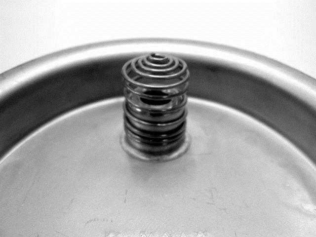 Lid Hatch Install the pressure relief valve filter spring on the inside of the lid hatch as shown in Fig. 8.