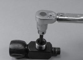 Secure the valve body assembly in a vise, using a 5mm hex key adapter (pn 8367A23) and inch pound torque wrench