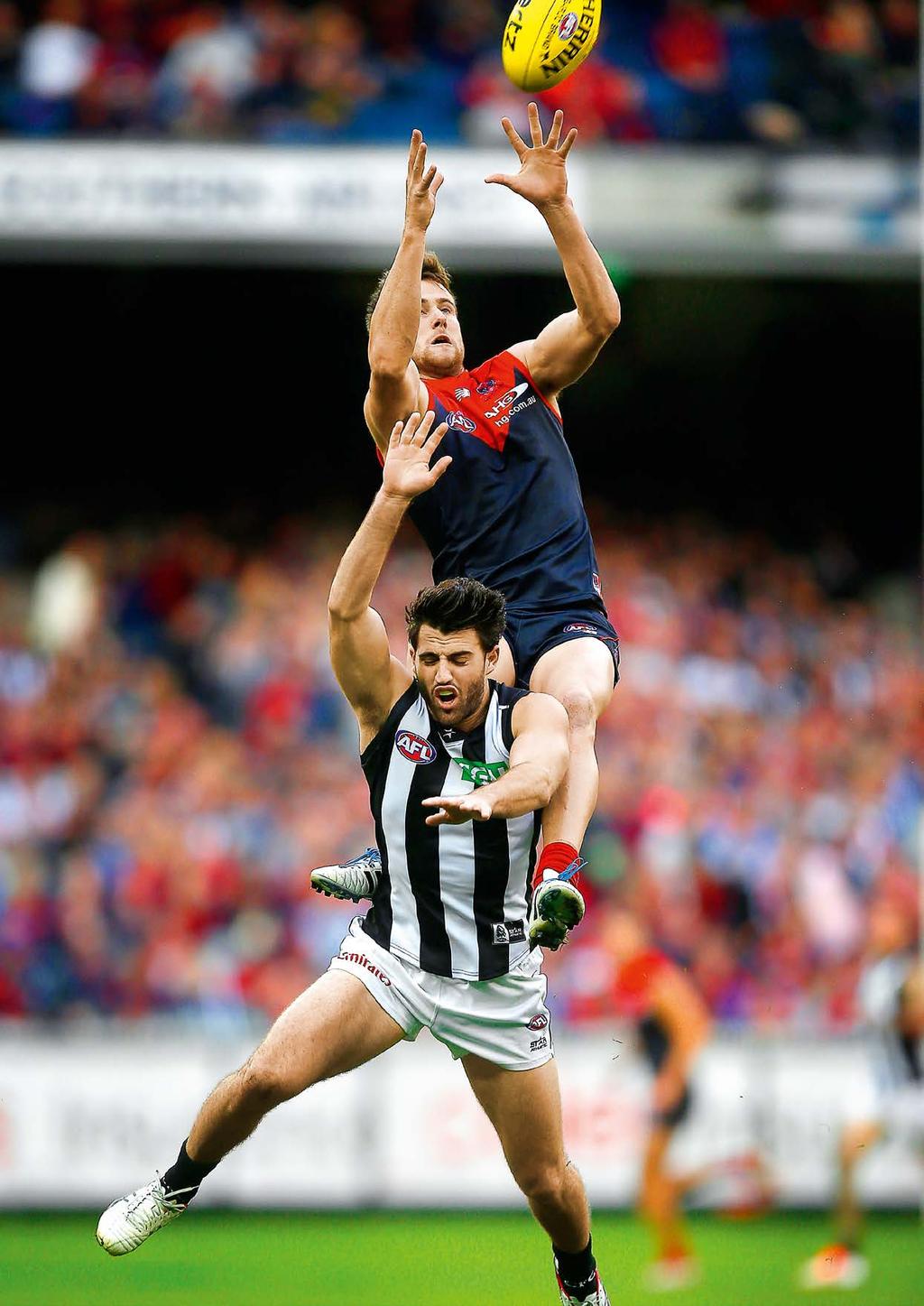 22 AFL ANNUAL REPORT 2014 CHAIRMAN'S REPORT 23 COMPETITIVE BALANCE EVERY TEAM, EVERY CHANCE HIGH HOPES Demon Jeremy Howe soars over Magpie Alex Fasolo in the Queen s Birthday blockbuster.