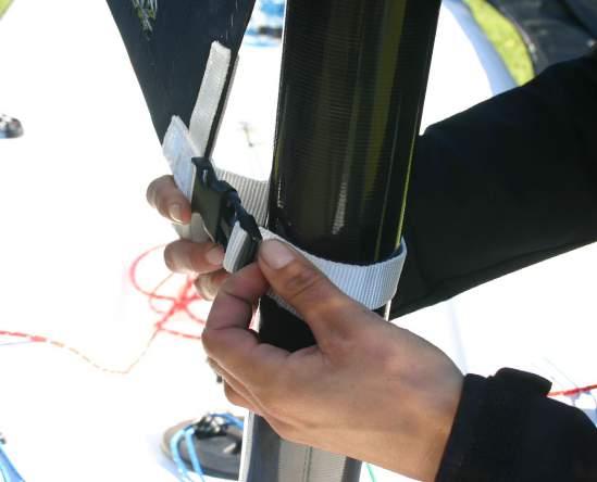 18. Use the clip to attach the foot of the sail to