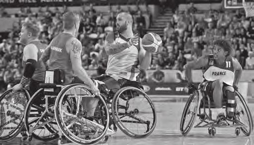 sports for players and spectators. It s fast, it s noisy and it s sometimes dangerous. What is it? It s wheelchair basketball. B But wheelchair basketball isn t a new sport.