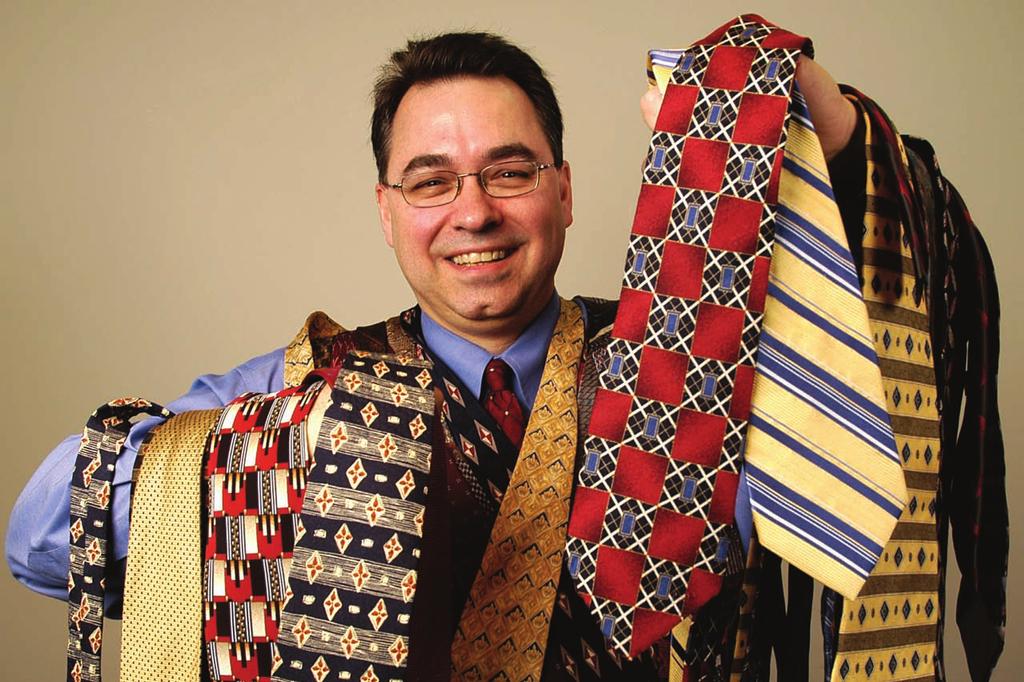 Doug Meadows displays some of the Ugliest Ties already entered Doug and his wife attend Restoration Life Christian Fellowship. winners. Each year they give away sixty gemstones.