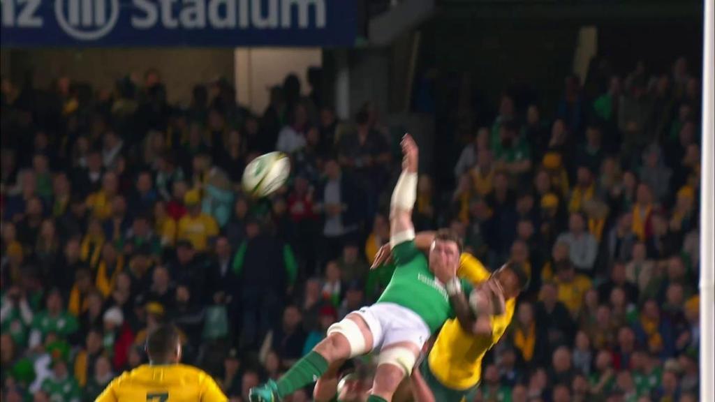 d. The Player s momentum from the jump takes his descent behind Ireland 7 even further, contact continues to be made with his arm still over Ireland 7 s