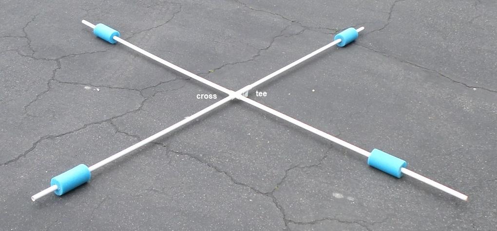 2. Insert the other end of the 3 cm length of PVC pipe into one side of a ½-inch PVC cross. Insert the other three lengths of pipe into the other openings of the PVC cross.