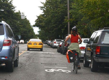 Busy street, sharrows Less safe, deters cycling Major street, parked cars, Major street,