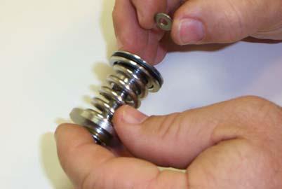 Figure 4-11 Thread the Nut onto the Poppet 15) When properly assembled, the Packing Disk (13), Poppet (8), and Piston Unit should have enough play to allow the Large Packing Disk (13) to slide