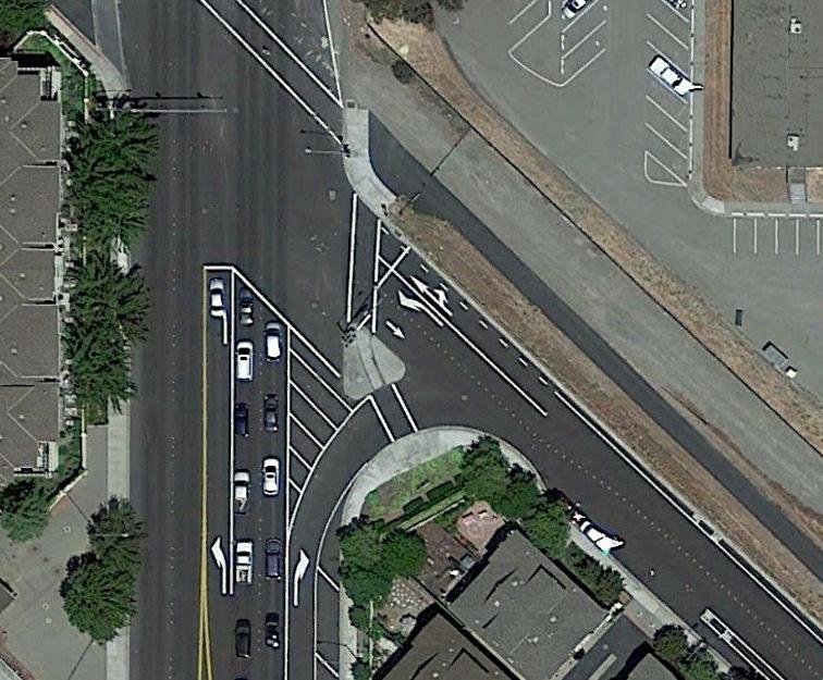They are large circular islands, placed in the middle of an intersection, which direct flow in a continuous circular direction around the intersection.