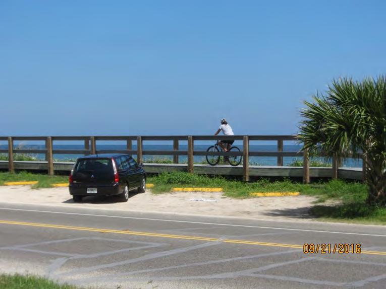 The study team observed bicyclists riding off the roadway either on the sidewalk (Figure 5) or along the boardwalk on the east side of SR AA (Figure 6).