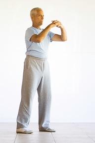 Wrist Rotation 2 1. Stand with your feet parallel and shoulder width apart.