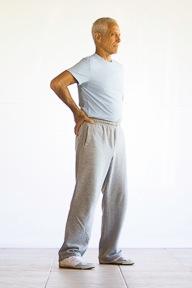 Hip Rotation 1. Stand with your feet parallel and shoulder width apart.