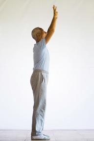 2. Continue to raise your hands up until your arms are fully extended, straight up overhead.